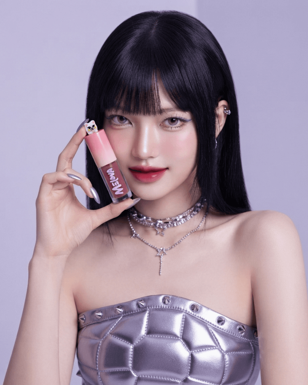 Model wearing Melova Velvet Berry lip tint